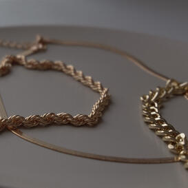 Three gold necklaces